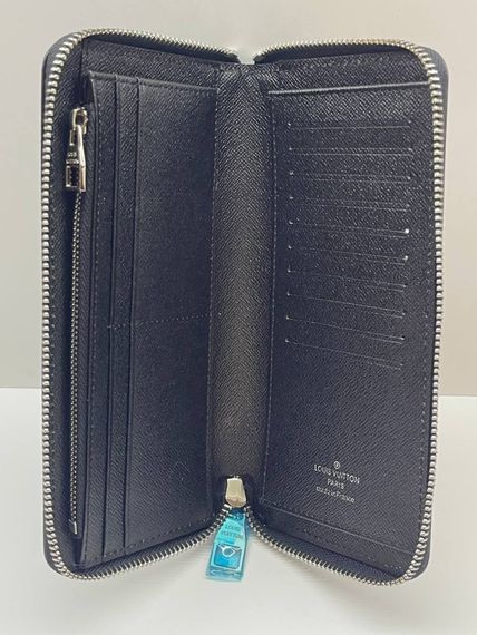Вертикальний гаманець Louis Vuitton Zippy сірий | Зображення 1