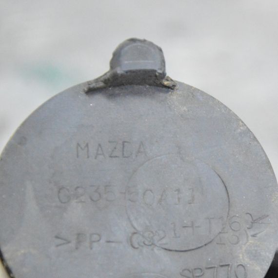 Заглушка крюка переднього бампера Mazda 5 2005-2009 Заглушка бампера переднього гака Мазда 5 C23550A11 | Зображення 2