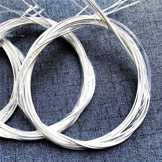 Струны струни НЕЙЛОНОВЫЕ СЕРЕБРЕННЫЕ для акустической классической гитары 028-043 на САМОЗАВЬЯЗКУ | Зображення 1