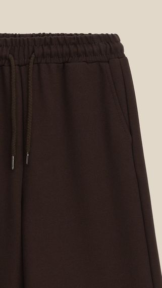Спортивні штани палаццо однотонні для дівчинки LAWA GTC02325 146 см Коричневий shop (2000999531408) | Зображення 1