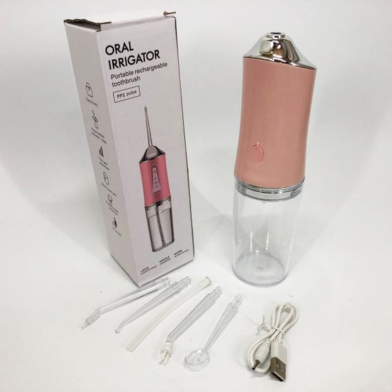 Ирригатор для чистки зубов и полости рта Oral Irrigator с аккумулятором и сменными насадками. Цвет: розовый | Зображення 1