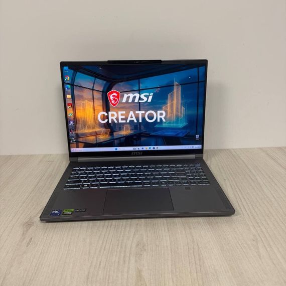 Ігровий ноутбук Б-клас MSI Creator 16 AI Studio A1VHG / 16" (3840x2400) IPS / Intel Core Ultra 9 185H (16 (22) ядер по 3.9 - 5.1 GHz) / 16 GB DDR5 / 1000 GB SSD NVMe / nVidia GeForce RTX 4080, 12 GB GDDR6, 192-bit / WebCam б/в | Зображення 1