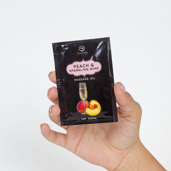 Масажна олійка - Secret Play Peach & Sparkling Wine, 10 мл | Зображення 1