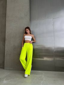 Женские яркие спортивные штаны-палаццо оверсайз SH400 цвет неоновый желтый, размер onesize 42/46