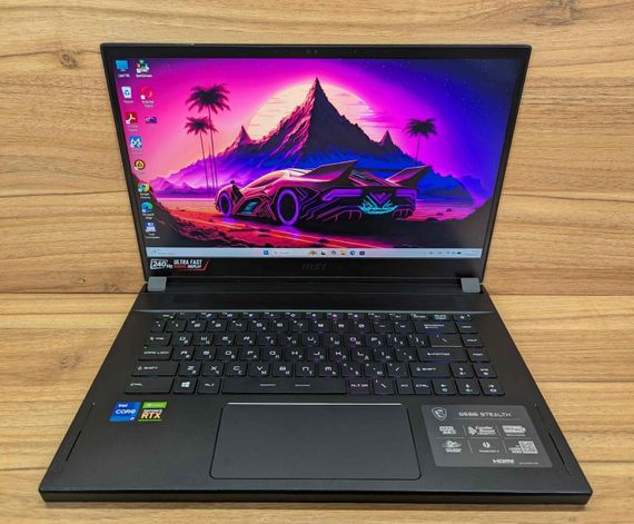 Ігровий ноутбук MSI GS66 Stealth 11UE / 15.6" (1920x1080) IPS / Intel Core i7-11800H (8 (16) ядер по 2.3 - 4.6 GHz) / 16 GB DDR4 / 1000 GB SSD / nVidia GeForce RTX 3060, 6 GB GDDR6, 192-bit / WebCam / Windows 11 б/в + Подарунок Бездротова миша / USB | Зображення 1