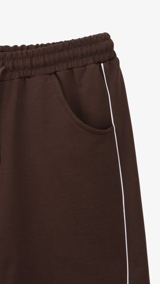 Спортивні штани однотонні для дівчинки Dinomin 18334 152 см Коричневий shop (2000999420597) | Зображення 1