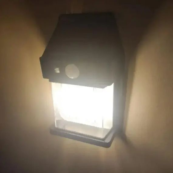 Настенный уличный светильник с солнечной панелью, фонарь с датчиком на движение SOLAR WALL LAMP YX-777 Black | Зображення 1