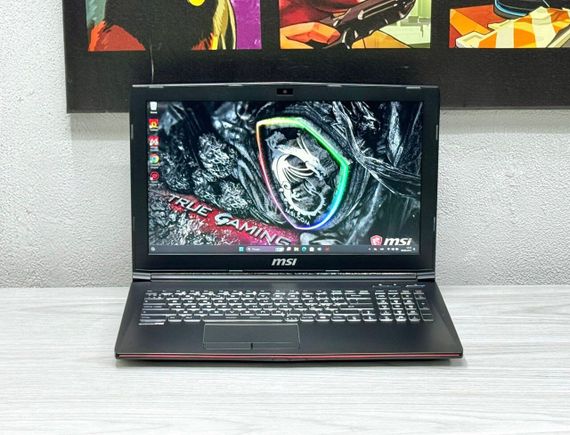 Ігровий ноутбук MSI GP62 / 15.6" (1920x1080) TN / Intel Core i7-7700HQ (4 (8) ядра по 2.8 - 3.8 GHz) / 16 GB DDR4 / 128 GB SSD M.2 + 1000 GB HDD / nVidia GeForce GTX 1060, 3 GB GDDR5, 192-bit / WebCam / Win 11 б/в | Зображення 1