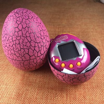 Интерактивная игрушка UFT электронный питомец Тамагочи в Яйце Динозавра Eggshell Game Pink (EggPink) | Зображення 1
