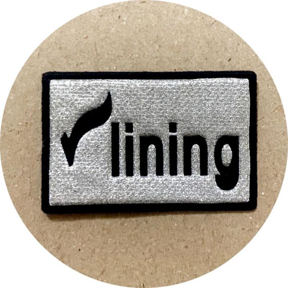 Нашивка на одяг (термо) Li Ning 49*32 мм Срібляста