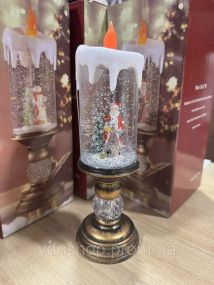 Дед Мороз Декоративная новогодняя LED свеча со снегом, 25см, от батареек и USB