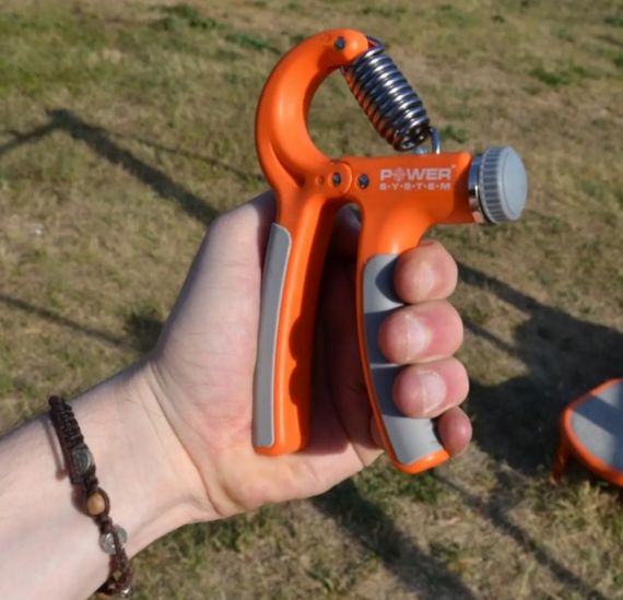 Еспандер кистьовий Power System PS-4021 з регульованим навантаженням 10-40 кг Power Hand Grip Orange (PS-4021_Orange) | Зображення 1