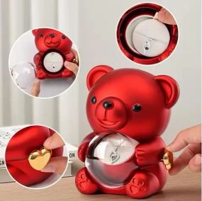 Скринька-ведмідь, що обертається, з трояндою в колбі