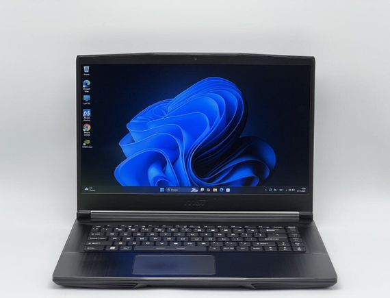Игровой ноутбук Б-класс MSI GF63 Thin 9SCXR-005 / 15.6" (1920x1080) IPS / Intel Core i5-9300H (4 (8) ядра по 2.4 - 4.1 GHz) / 16 GB DDR4 / 480 GB SSD / nVidia GeForce GTX 1650 Max-Q, 4 GB GDDR6, 128-bit / WebCam б/у | Зображення 1