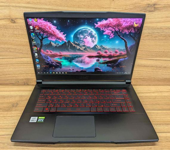Игровой ноутбук MSI GF65 Thin 10uE / 15.6" (1920x1080) IPS / Intel Core i7-10750H (6 (12) ядер по 2.6 - 5.0 GHz) / 16 GB DDR4 / 512 GB SSD / nVidia GeForce RTX 3060, 6 GB GDDR6, 192-bit / WebCam / Windows 10 б/у + Подарок Беспроводная мышь / USB | Зображення 1