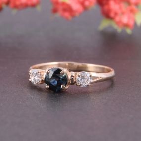 Кольцо из красного золота с топазом London Blue