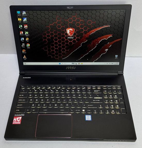 Игровой ноутбук MSI MegaBook GS63 Stealth 8RE / 15.6" (1920x1080) IPS / Intel Core i7-8750H (6 (12) ядер по 2.2 - 4.1 GHz) / 32 GB DDR4 / 512 GB SSD / nVidia GeForce GTX 1060, 6 GB GDDR5, 192-bit / WebCam б/у | Зображення 1