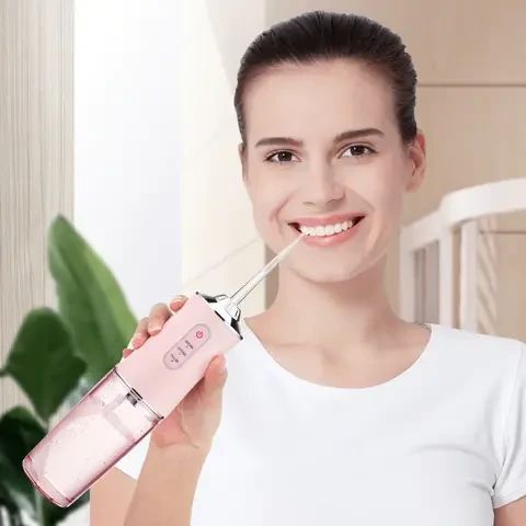 Ирригатор портативный Oral Irrigator 3 режима работы, 2 насадки | Зображення 5