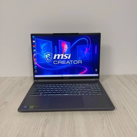 Игровой ноутбук Б-класс MSI Creator 16 AI Studio A1VHG / 16" (3840x2400) IPS / Intel Core Ultra 9 185H (16 (22) ядер по 3.9 - 5.1 GHz) / 32 GB DDR5 / 1000 GB SSD NVMe / nVidia GeForce RTX 4080, 12 GB GDDR6, 192-bit / WebCam б/у | Зображення 1