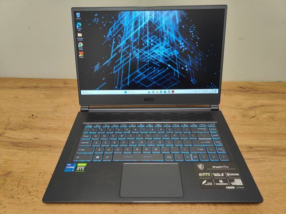 Игровой ноутбук MSI Stealth 15M A11UEKV / 15.6" (1920x1080) IPS / Intel Core i7-11375H (4 (8) ядра по 3.0 - 5.0 GHz) / 16 GB DDR4 / 512 GB SSD / nVidia GeForce RTX 3060, 6 GB GDDR6, 192-bit / WebCam / Windows 10 Home б/у | Зображення 1