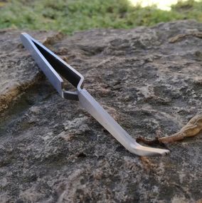 Зворотний пінцет для затиску арки