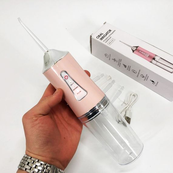 Ирригатор для чистки зубов и полости рта Oral Irrigator с аккумулятором и сменными насадками. Цвет: розовый | Зображення 8