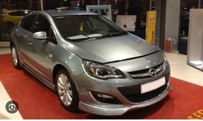Передняя нижняя накладка 2012-2015 (под покраску) для Opel Astra J