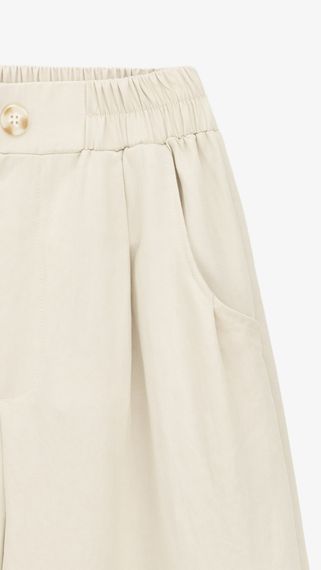 Штани однотонні для дівчинки Dinomin 2507 146 см Бежевий shop (2000999461286) | Зображення 1
