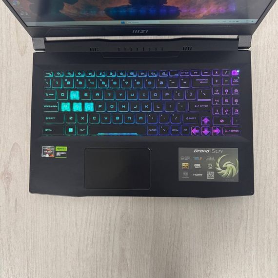 Игровой ноутбук Б-класс MSI Bravo 15 C7VFK / 15.6" (1920x1080) IPS / AMD Ryzen 7 7735HS (8 (16) ядер по 3.2 - 4.75 GHz) / 16 GB DDR5 / 512 GB SSD NVMe / nVidia GeForce RTX 4060, 8 GB GDDR6, 128-bit / WebCam б/у | Зображення 2