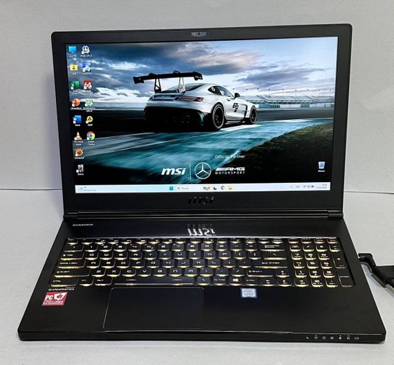 Ігровий ноутбук Б-класу MSI GS63 Stealth 8RE / 15.6" (1920x1080) IPS / Intel Core i7-8750H (6 (12) ядер по 2.2 - 4.1 GHz) / 16 GB DDR4 / 512 GB SSD / nVidia GeForce GTX 1060, 6 GB GDDR5, 192-bit / WebCam / Win 11 Pro б/в | Зображення 1