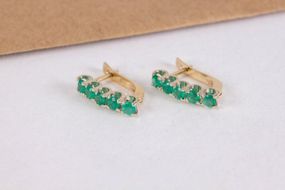Женские серьги из желтого и белого золота с изумрудами