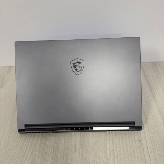 Игровой ноутбук Б-класс MSI Creator 16 AI Studio A1VHG / 16" (3840x2400) IPS / Intel Core Ultra 9 185H (16 (22) ядер по 3.9 - 5.1 GHz) / 32 GB DDR5 / 1000 GB SSD NVMe / nVidia GeForce RTX 4080, 12 GB GDDR6, 192-bit / WebCam б/у | Зображення 2