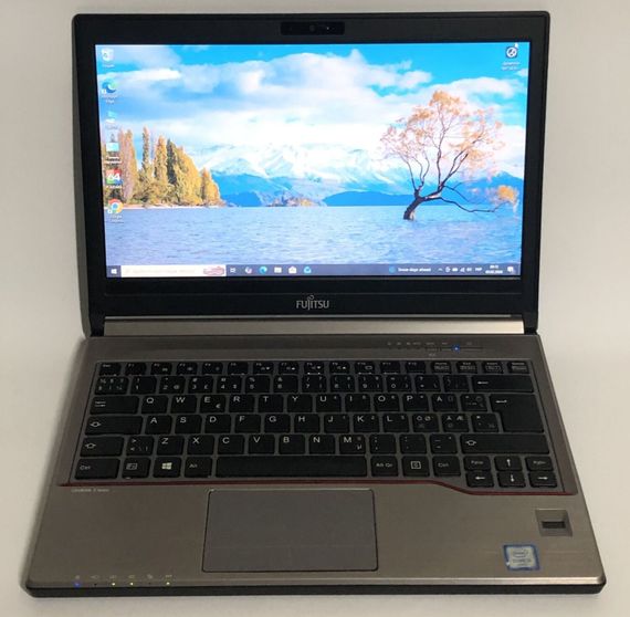Ноутбук Б-клас Fujitsu LifeBook E733 / 13.3" (1366x768) TN / Intel Core i7-3632QM (4 (8) ядра по 2.2 - 3.2 GHz) / 8 GB DDR3 / 256 GB SSD / Intel HD Graphics 4000 / WebCam / Win 10 Pro б/в | Зображення 1