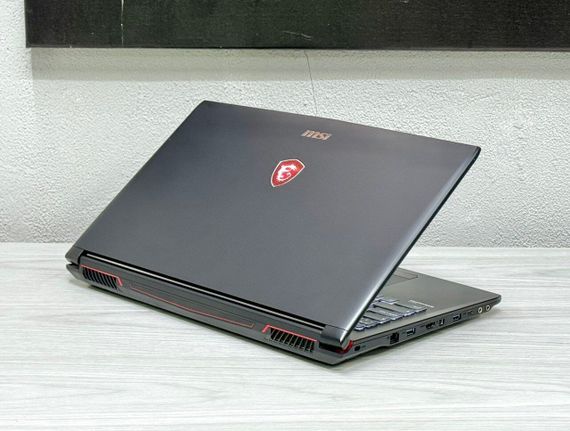 Ігровий ноутбук MSI GP62 / 15.6" (1920x1080) TN / Intel Core i7-7700HQ (4 (8) ядра по 2.8 - 3.8 GHz) / 16 GB DDR4 / 128 GB SSD M.2 + 1000 GB HDD / nVidia GeForce GTX 1060, 3 GB GDDR5, 192-bit / WebCam / Win 11 б/в | Зображення 4