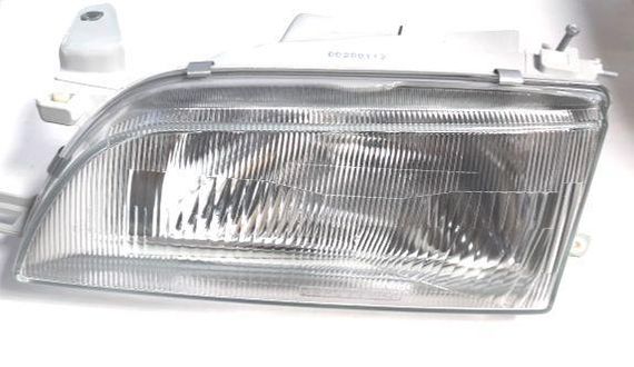 Фара Toyota Corolla E10 седан (91-97) ліва FP 8112 R1-E 81150-1E550A 81170-1A552