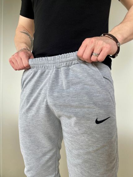 Штани чоловічі трикотажні Nike світло-сірі | Зображення 3