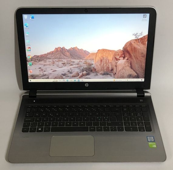 Ноутбук HP Pavilion 15 / 15.6" (1920x1080) TN / Intel Core i5-6200U (2 (4) ядра по 2.3 - 2.8 GHz) / 8 GB DDR3 / 256 GB SSD / GeForce 940M, 2 GB DDR3, 64-bit / WebCam / Win 10 Home б/в + Подарунок Флешка Kingston 64GB | Зображення 1