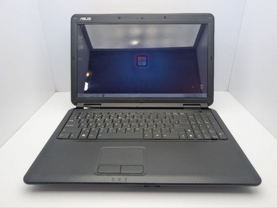 Ноутбук Asus K50C / 15.6" (1366x768) TN / Intel Celeron 220 (1 ядро по 1.2 GHz) / 4 GB DDR2 / 120 GB HDD / Intel Graphics / WebCam / DVD-ROM / АБК не тримає б/в | Зображення 1