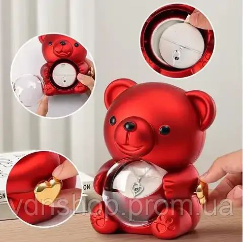 Скринька-ведмідь, що обертається, з трояндою в колбі