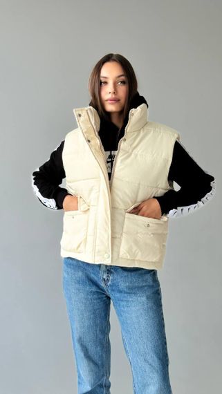 Жіноча жилетка молочна