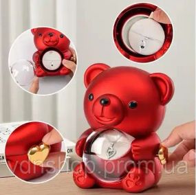Скринька-ведмідь, що обертається, з трояндою в колбі