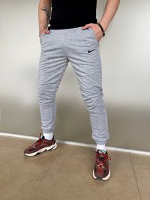 Штани чоловічі трикотажні Nike світло-сірі